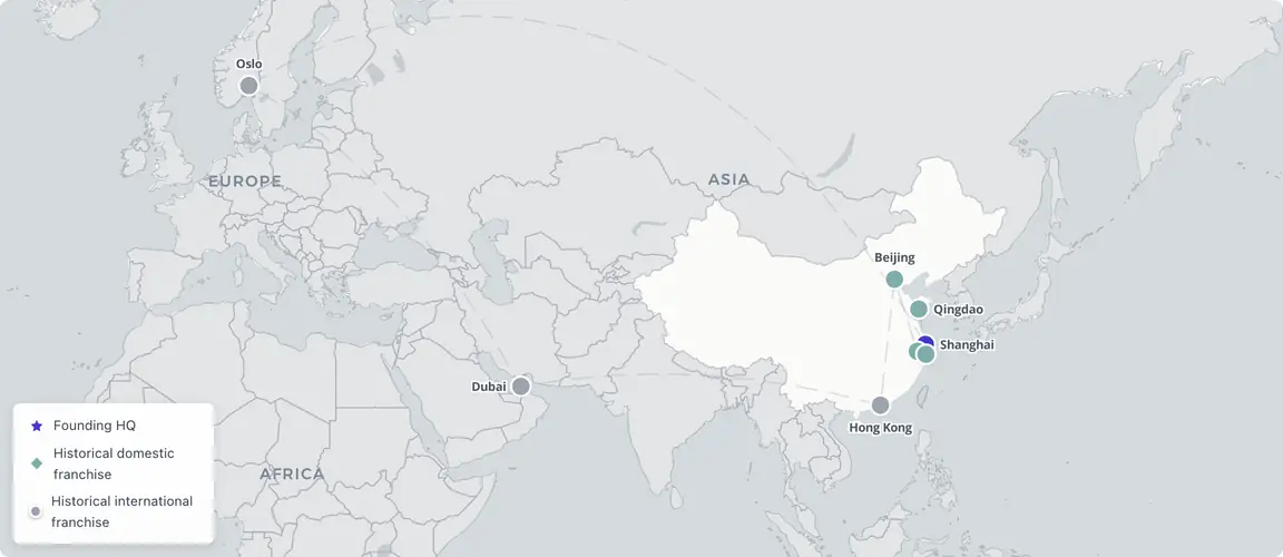 Shanghai 2003 founding + three historical international franchises (Oslo 2005, Dubai 2008, Hong Kong 2010) — the export experiment proved a Chinese service brand could transfer Academy-trained quality across cultures.